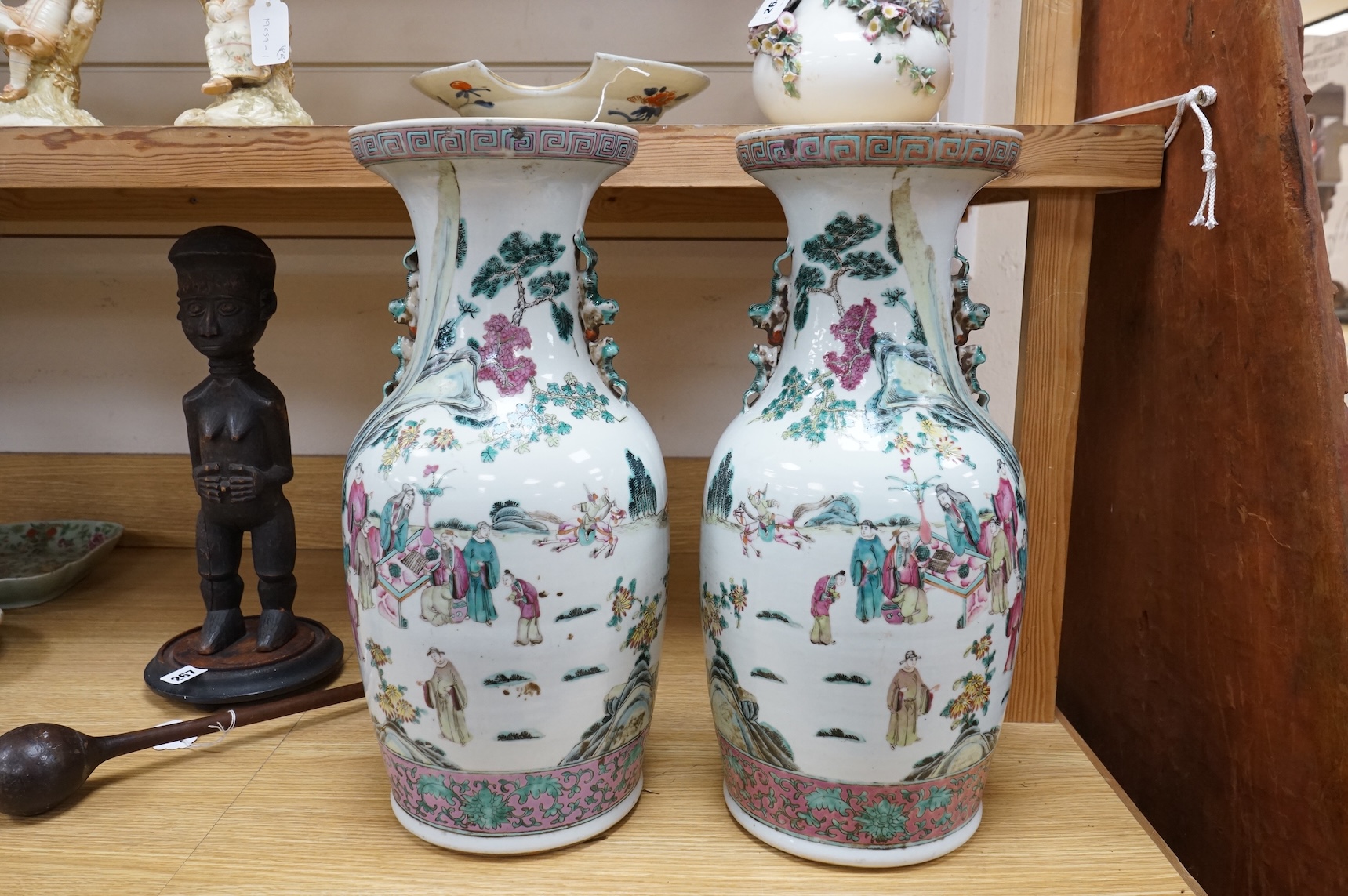 A pair of large late 19th century Chinese famille rose ‘scholars’ vases, 45cm high